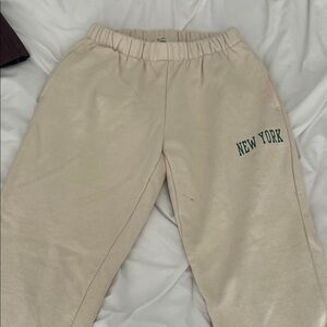 Brandy Melville Cream Track Pants with New York Print